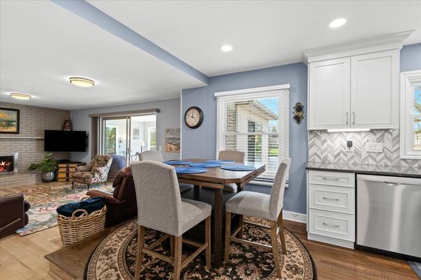 Dining room, Fireplace, Interior, Kitchen, Living room, Recessed Lighting, Stone Walls, Wood Texture Flooring