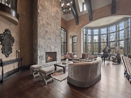 Chandelier, Fireplace, Interior, Living room, Piano, Stone Walls, Wooden Beams, Wood Texture Flooring