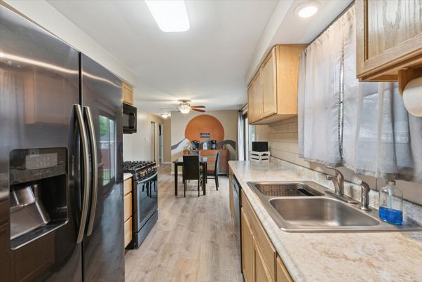 Dining room, Interior, Kitchen, Recessed Lighting, Stainless Steel Appliances, Wood Texture Flooring