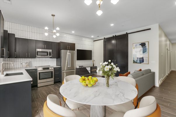 Dining room, Interior, Kitchen, Pendant Lights, Recessed Lighting, Stainless Steel Appliances, Wood Texture Flooring