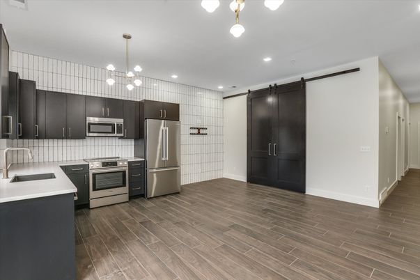 Interior, Kitchen, Pendant Lights, Recessed Lighting, Stainless Steel Appliances, Wood Texture Flooring