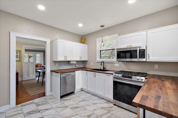 Dining room, Interior, Kitchen, Marble, Pendant Lights, Recessed Lighting, Stainless Steel Appliances, Wood Texture Flooring