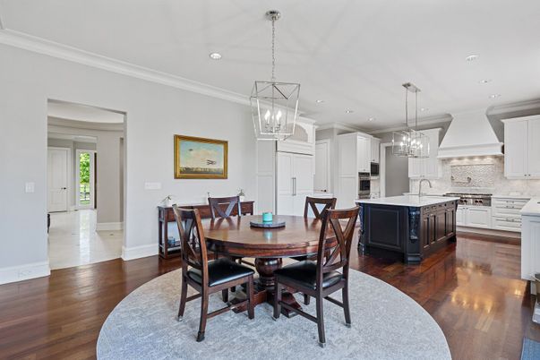 Chandelier, Dining room, Interior, Kitchen, Pendant Lights, Recessed Lighting, Stainless Steel Appliances, Wood Texture Flooring