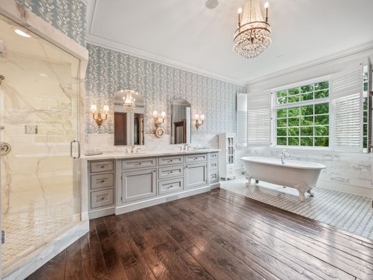 Bathroom, Chandelier, Dual Sink Vanities, Free Standing Baths, Glass Shower, Interior, Marble Walls, Wood Texture Flooring