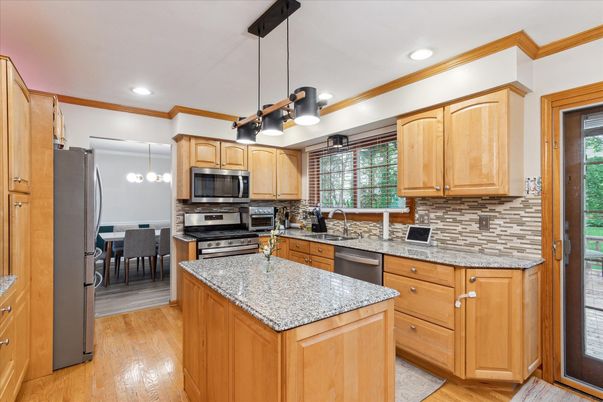 Dining room, Interior, Kitchen, Pendant Lights, Recessed Lighting, Stainless Steel Appliances, Wood Texture Flooring