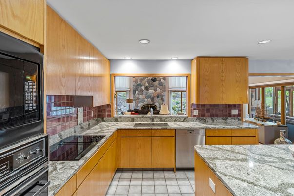 Fireplace, Interior, Kitchen, Recessed Lighting, Stainless Steel Appliances, Stone Walls
