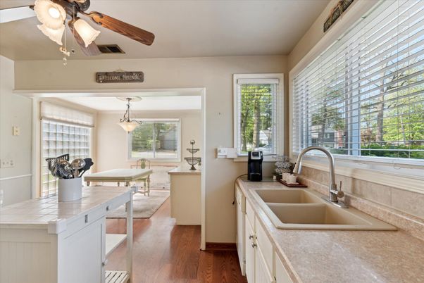 Interior, Kitchen, Pendant Lights, Tile Countertops, Wood Texture Flooring
