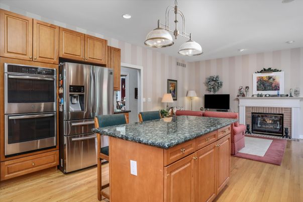 Fireplace, Interior, Kitchen, Recessed Lighting, Stainless Steel Appliances, Wood Texture Flooring