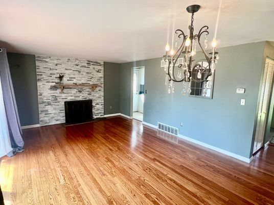 Chandelier, Empty room, Fireplace, Interior, Stone Walls, Wood Texture Flooring