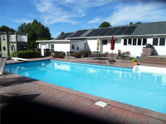 Exterior, Pool, Solar Panels