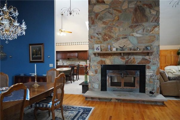 Chandelier, Dining room, Fireplace, Interior, Kitchen, Stone Walls, Wood Texture Flooring