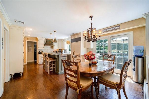 Chandelier, Dining room, Interior, Kitchen, Pendant Lights, Recessed Lighting, Stainless Steel Appliances, Wood Texture Flooring