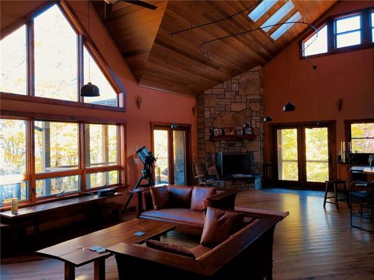 Fireplace, Fitness Equipment, Interior, Living room, Pendant Lights, Stone Walls, Wooden Beams, Wooden Ceilings, Wood Texture Flooring