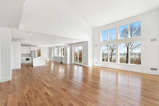 Empty room, Interior, Kitchen, Recessed Lighting, Stainless Steel Appliances, Wood Texture Flooring