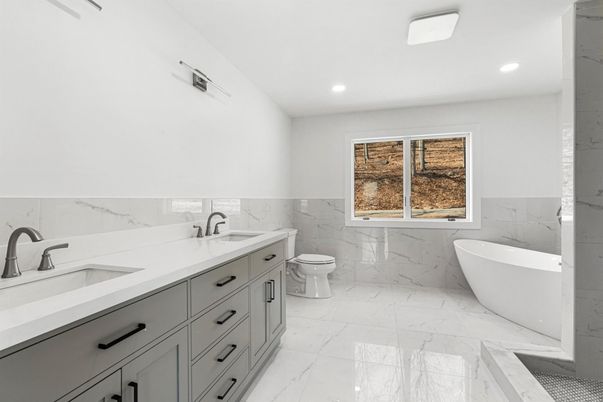 Bathroom, Dual Sink Vanities, Free Standing Baths, Interior, Marble, Marble Walls, Recessed Lighting
