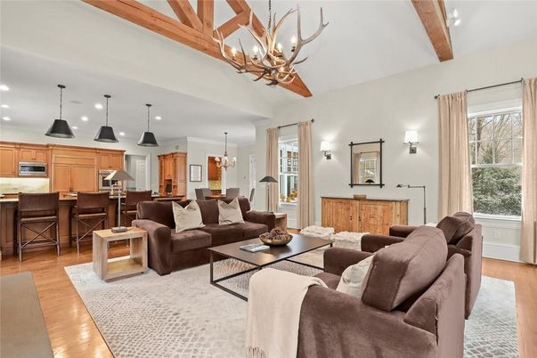 Chandelier, Dining room, Interior, Kitchen, Living room, Pendant Lights, Recessed Lighting, Stainless Steel Appliances, Wooden Beams, Wood Texture Flooring