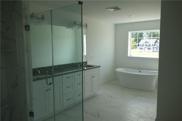 Bathroom, Dual Sink Vanities, Free Standing Baths, Glass Shower, Interior, Marble, Marble Walls, Recessed Lighting