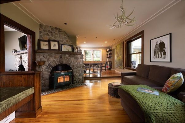 Dining room, Fireplace, Interior, Living room, Recessed Lighting, Stone Walls, Wood Texture Flooring