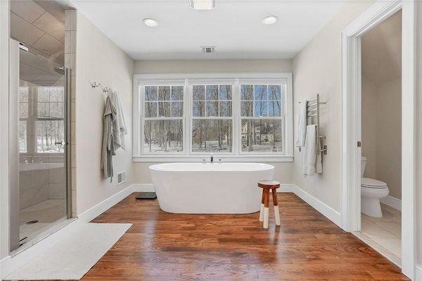 Bathroom, Free Standing Baths, Glass Shower, Interior, Recessed Lighting, Wood Texture Flooring