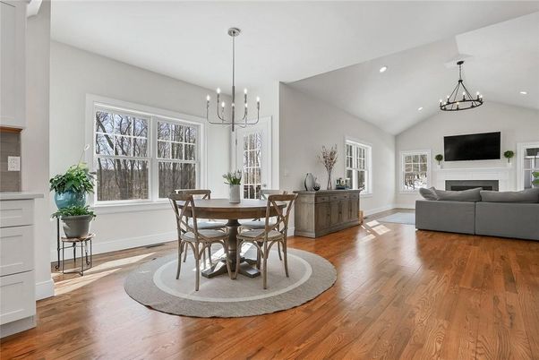 Chandelier, Dining room, Fireplace, Interior, Living room, Pendant Lights, Recessed Lighting, Wood Texture Flooring