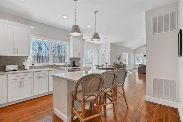 Chandelier, Dining room, Interior, Kitchen, Pendant Lights, Recessed Lighting, Stainless Steel Appliances, Wood Texture Flooring