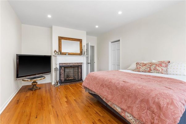 Bedroom, Fireplace, Interior, Recessed Lighting, Wood Texture Flooring