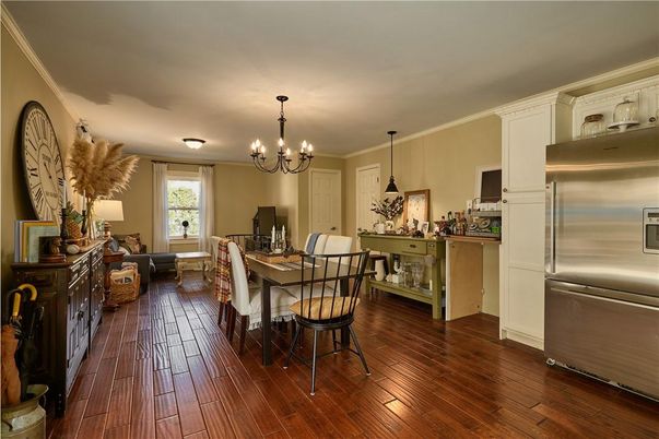 Chandelier, Dining room, Interior, Kitchen, Living room, Pendant Lights, Stainless Steel Appliances, Wood Texture Flooring