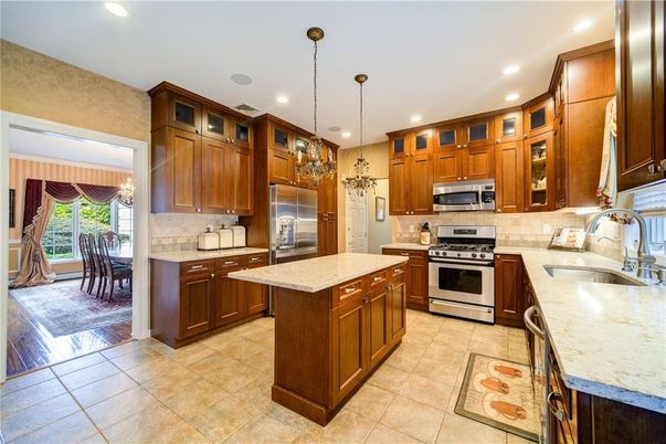 Chandelier, Dining room, Interior, Kitchen, Pendant Lights, Recessed Lighting, Stainless Steel Appliances, Wood Texture Flooring