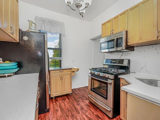 Chandelier, Interior, Kitchen, Marble Walls, Stainless Steel Appliances, Wood Texture Flooring