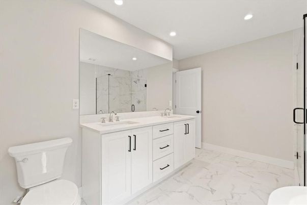 Bathroom, Dual Sink Vanities, Glass Shower, Interior, Marble, Marble Walls, Recessed Lighting