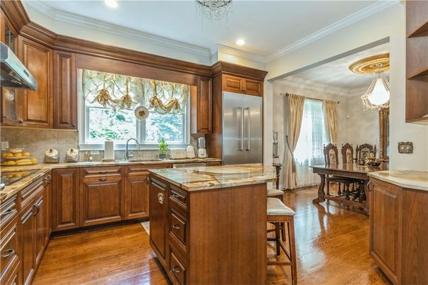 Chandelier, Dining room, Interior, Kitchen, Recessed Lighting, Stainless Steel Appliances, Wood Texture Flooring