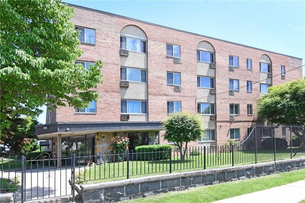 Exterior, Facade, Brick Facade, Condo Building