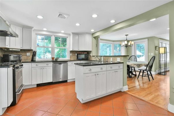 Chandelier, Dining room, Interior, Kitchen, Recessed Lighting, Stainless Steel Appliances, Wood Texture Flooring