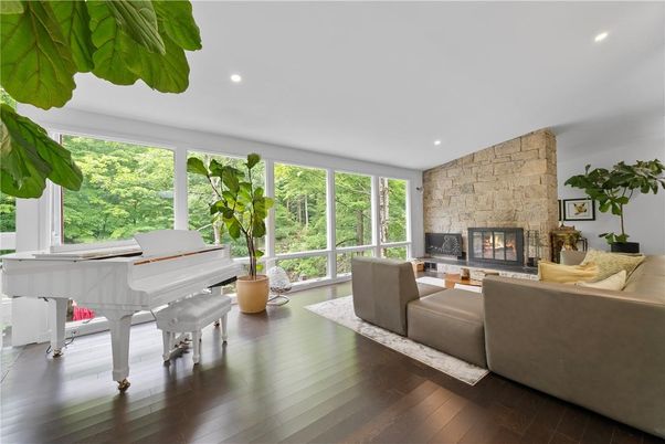 Fireplace, Interior, Living room, Piano, Recessed Lighting, Stone Walls, Wood Texture Flooring