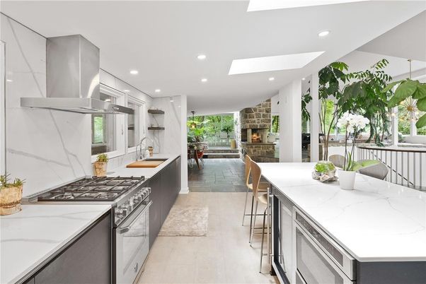 Fireplace, Interior, Kitchen, Marble Walls, Recessed Lighting, Stainless Steel Appliances, Stone Walls