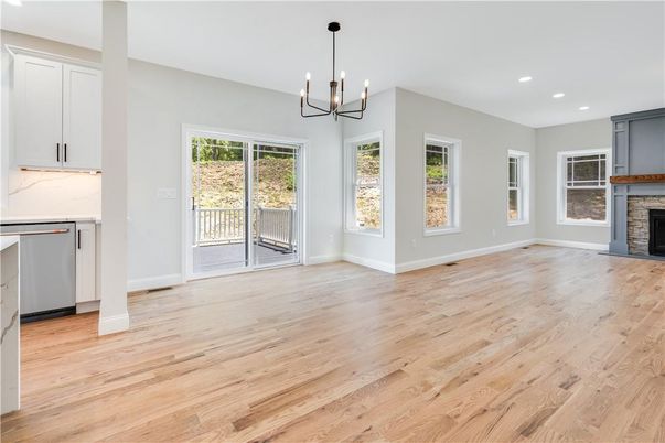 Empty room, Fireplace, Interior, Kitchen, Pendant Lights, Recessed Lighting, Wood Texture Flooring