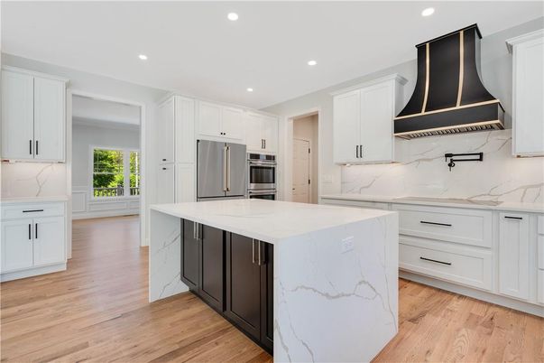 Interior, Kitchen, Marble Walls, Recessed Lighting, Stainless Steel Appliances, Wood Texture Flooring