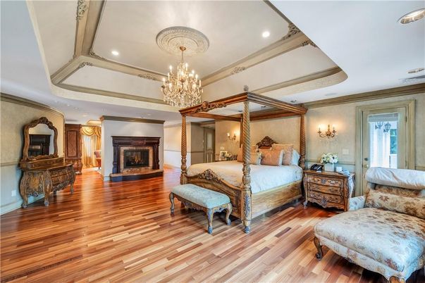 Bedroom, Chandelier, Fireplace, Interior, Recessed Lighting, Wood Texture Flooring