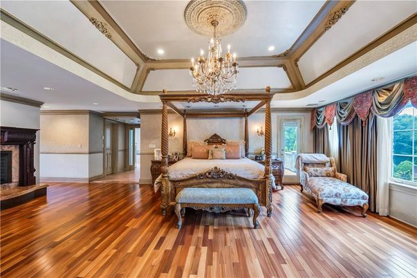 Bedroom, Chandelier, Fireplace, Interior, Recessed Lighting, Wood Texture Flooring