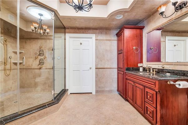 Bathroom, Chandelier, Dual Sink Vanities, Glass Shower, Interior, Recessed Lighting
