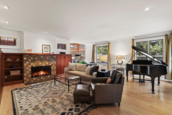 Fireplace, Interior, Living room, Piano, Recessed Lighting, Wood Texture Flooring