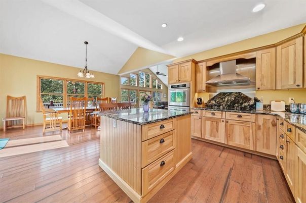 Chandelier, Dining room, Interior, Kitchen, Pendant Lights, Recessed Lighting, Stainless Steel Appliances, Wood Texture Flooring