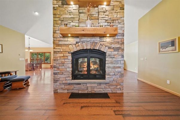 Dining room, Fireplace, Interior, Pendant Lights, Recessed Lighting, Stone Walls, Wood Texture Flooring