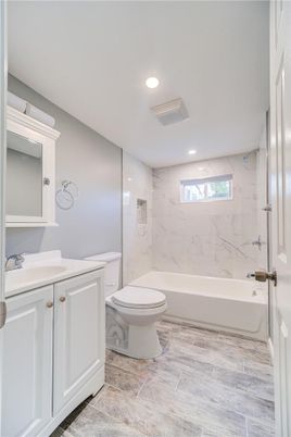 Bathroom, Interior, Marble Walls, Recessed Lighting, Wood Texture Flooring