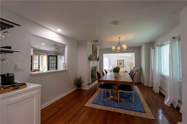 Chandelier, Dining room, Fireplace, Interior, Recessed Lighting, Wood Texture Flooring