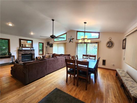 Dining room, Fireplace, Interior, Living room, Pendant Lights, Recessed Lighting, Wood Texture Flooring