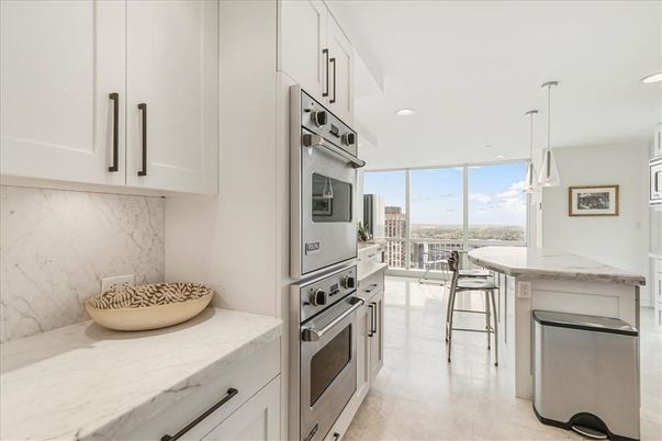 Interior, Kitchen, Marble Walls, Pendant Lights, Recessed Lighting, Stainless Steel Appliances
