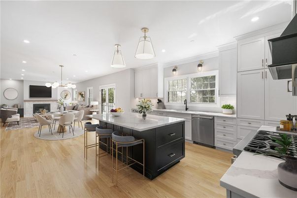 Dining room, Fireplace, Interior, Kitchen, Living room, Pendant Lights, Recessed Lighting, Stainless Steel Appliances, Wood Texture Flooring