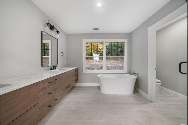 Bathroom, Dual Sink Vanities, Free Standing Baths, Interior, Recessed Lighting, Wood Texture Flooring
