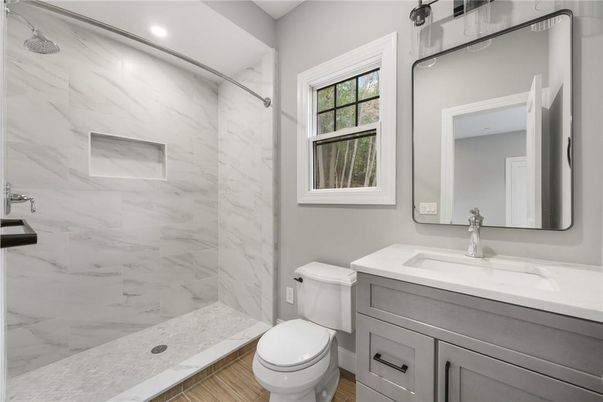 Bathroom, Glass Shower, Interior, Marble Walls, Recessed Lighting, Wood Texture Flooring